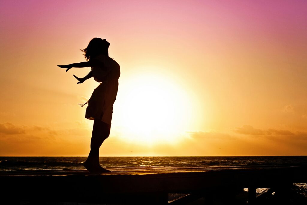 lady in beach silhouette in daytime