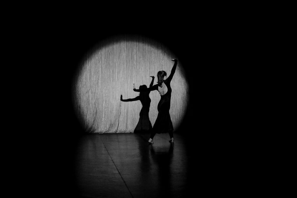 dancer in spotlight on stage