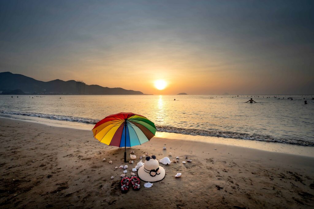 people on beach during sunset