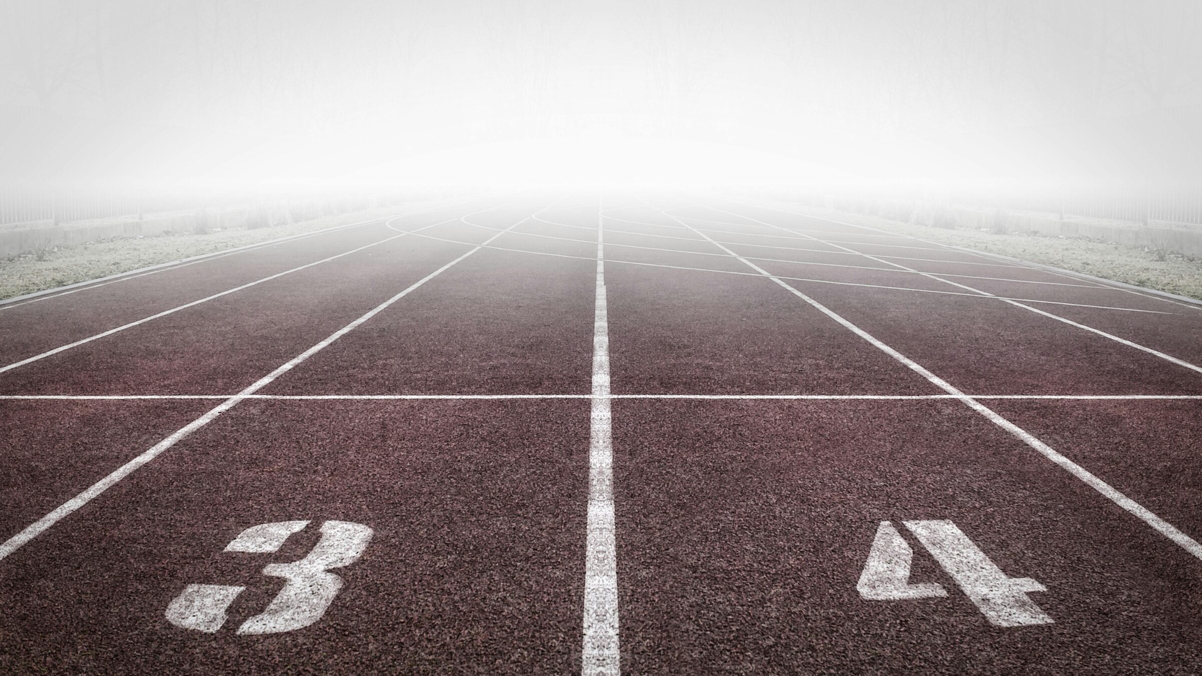 brown and white track field starting line