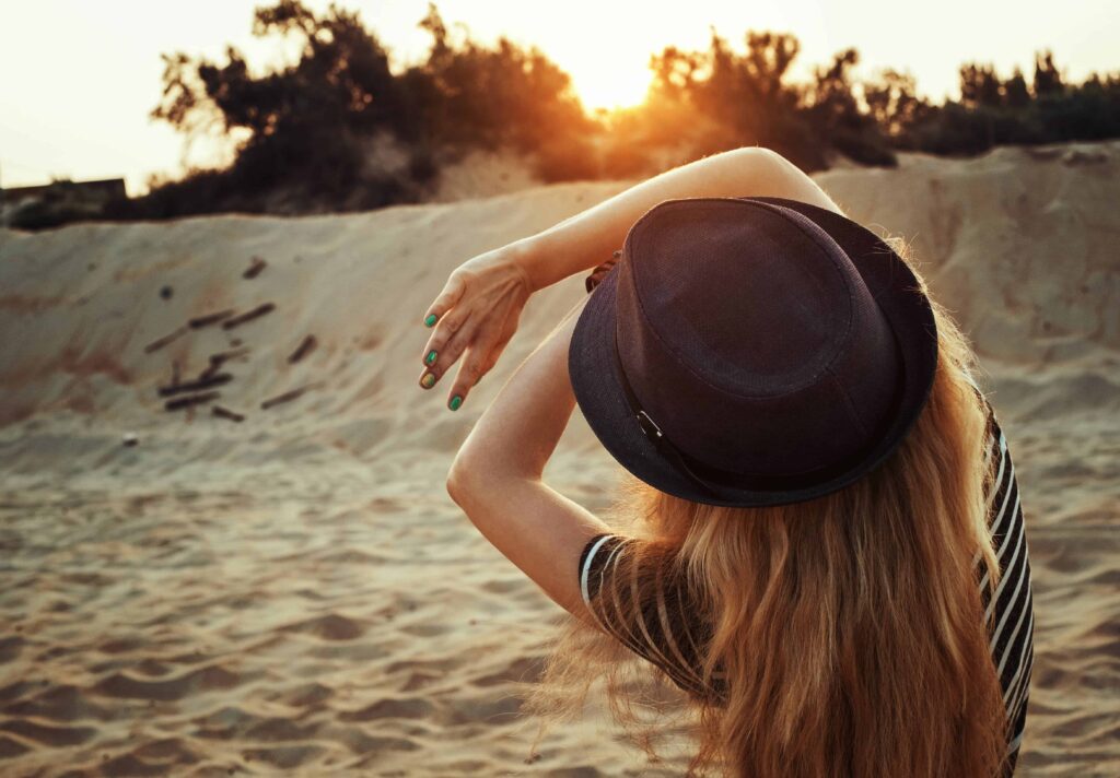 woman covering face with both hands