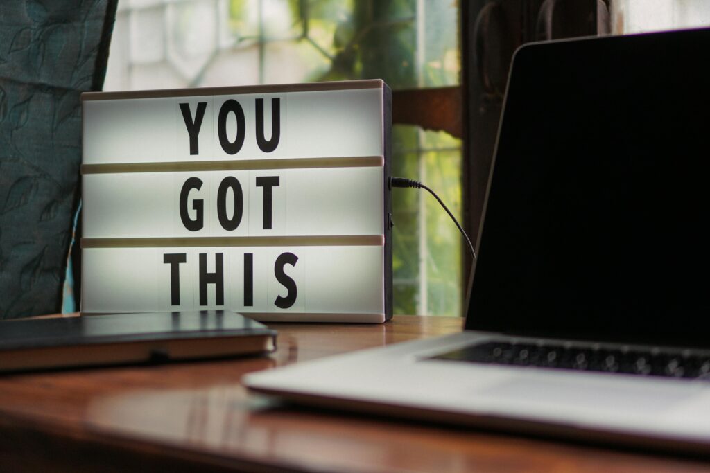 you got this sign on desk next to computer