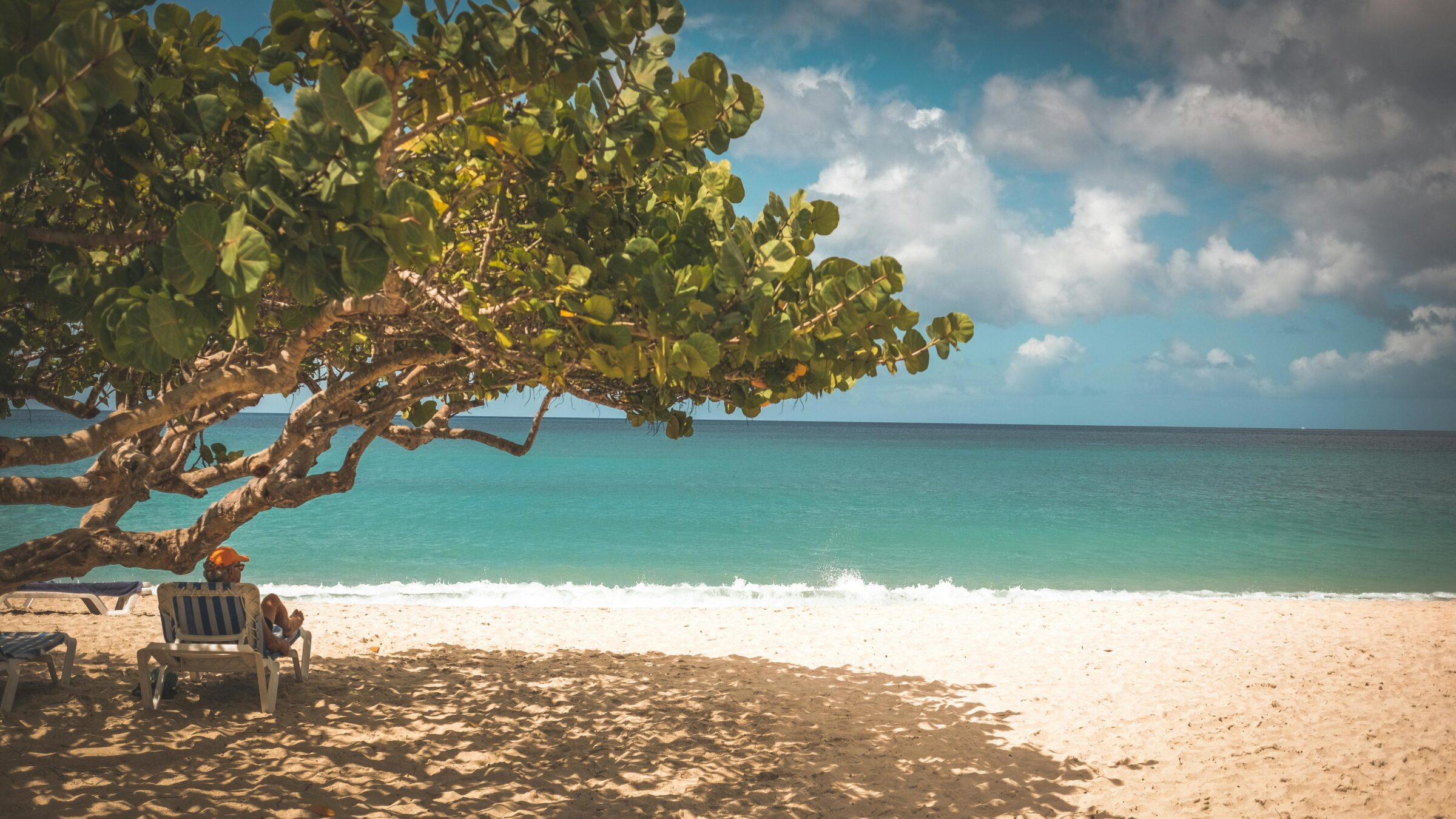 person sitting on beach chair