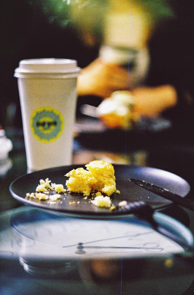 cup and leftover food on table